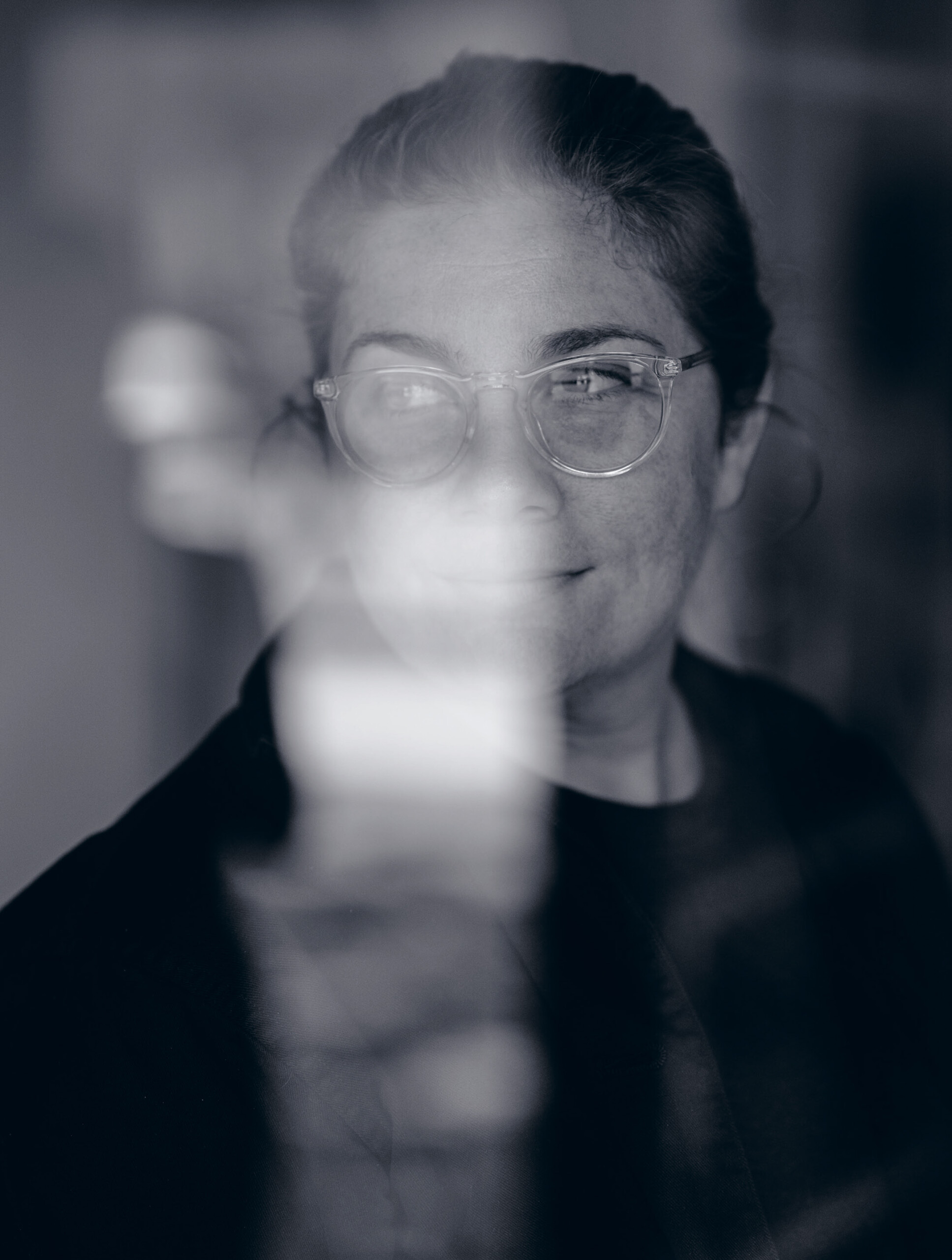 Portrait Madeline Gannon; photographed through a window